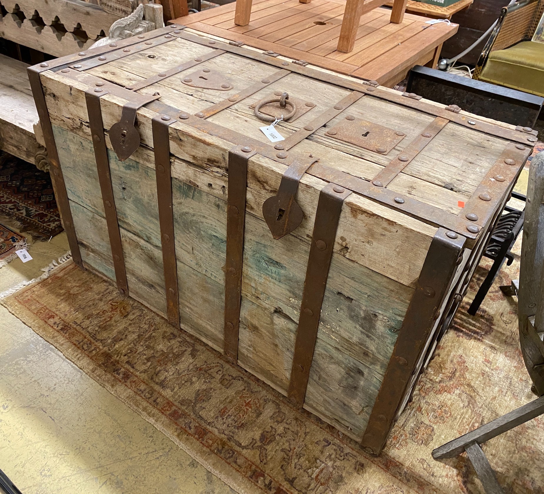 A large iron-bound rectangular wood Armada style chest, width 122cm, depth 61cm, height 74cm